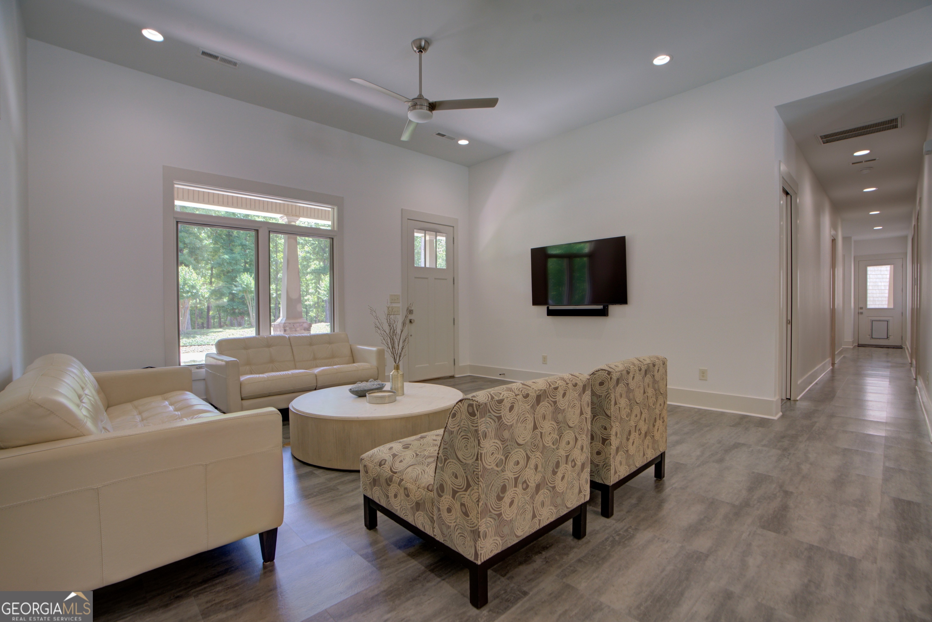 610 Kings Bridge Road Cave Spring, GA 30124 - Photo 7 of 72 a living room with furniture and a flat screen tv