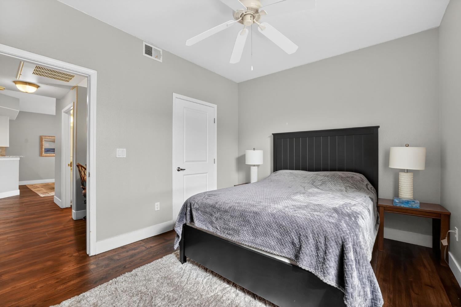 1501 Secret Ravine Parkway, Unit 1916 Roseville, CA 95661 - Photo 15 of 41 a bedroom with a bed and wooden floor