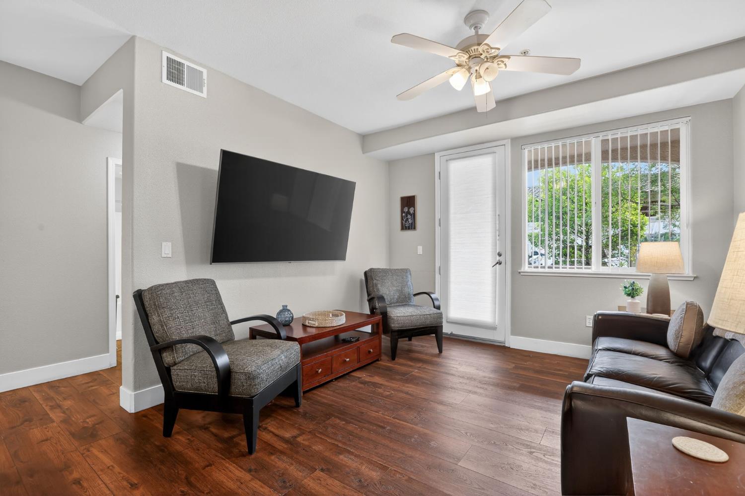 1501 Secret Ravine Parkway, Unit 1916 Roseville, CA 95661 - Photo 19 of 41 a living room with furniture and a flat screen tv
