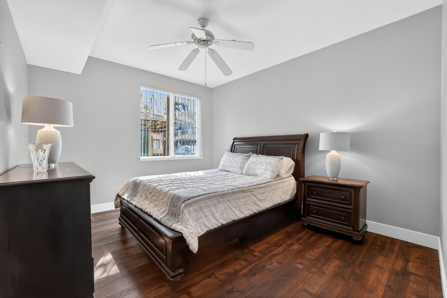 1501 Secret Ravine Parkway, Unit 1916 Roseville, CA 95661 - Photo 23 of 41 a bedroom with a bed wooden floor and window