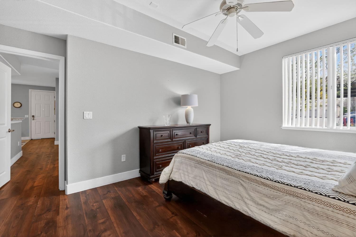 1501 Secret Ravine Parkway, Unit 1916 Roseville, CA 95661 - Photo 24 of 41 a bedroom with a bed and a chandelier