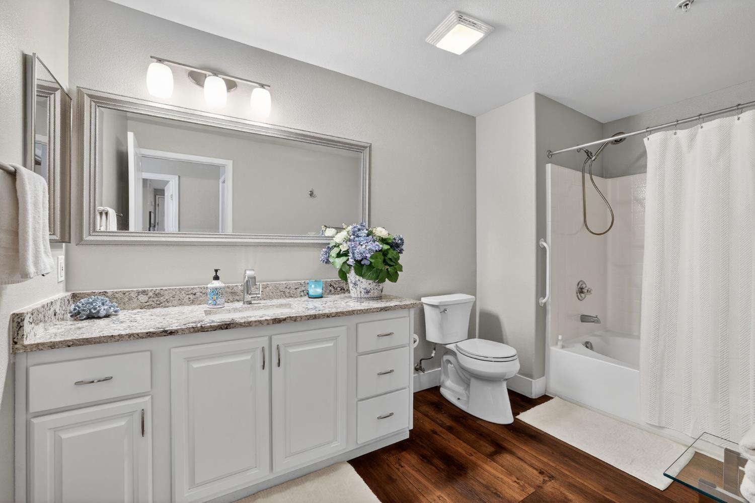 1501 Secret Ravine Parkway, Unit 1916 Roseville, CA 95661 - Photo 25 of 41 a bathroom with a double vanity sink toilet and shower