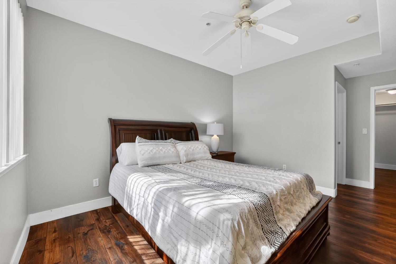 1501 Secret Ravine Parkway, Unit 1916 Roseville, CA 95661 - Photo 27 of 41 a bedroom with a bed and a chandelier