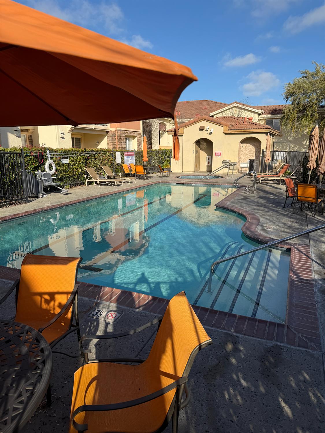 1501 Secret Ravine Parkway, Unit 1916 Roseville, CA 95661 - Photo 31 of 41 an outdoor sitting area with swimming pool and furniture