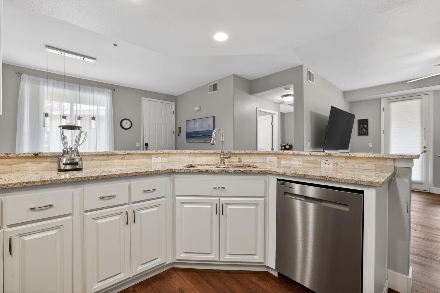 1501 Secret Ravine Parkway, Unit 1916 Roseville, CA 95661 - Photo 6 of 41 a bathroom with a granite countertop sink and a mirror