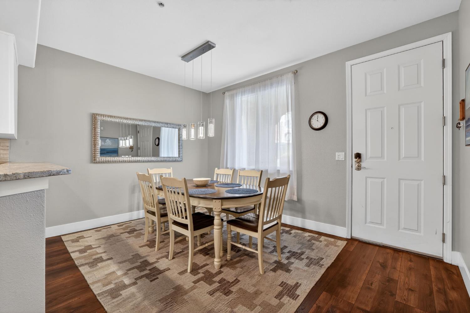 1501 Secret Ravine Parkway, Unit 1916 Roseville, CA 95661 - Photo 8 of 41 a view of a dining room with furniture and wooden floor