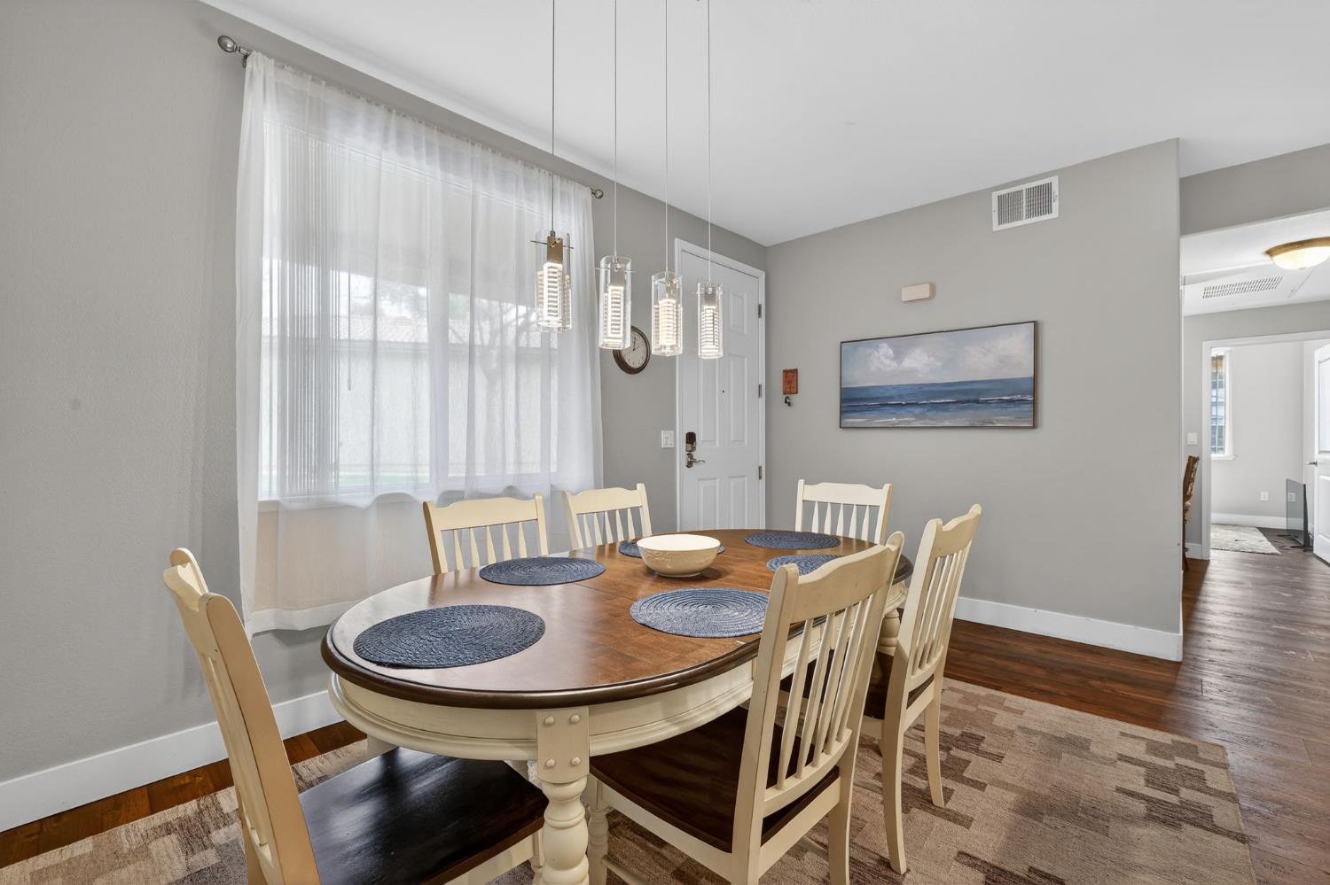 1501 Secret Ravine Parkway, Unit 1916 Roseville, CA 95661 - Photo 9 of 41 a view of a dining room with furniture and wooden floor