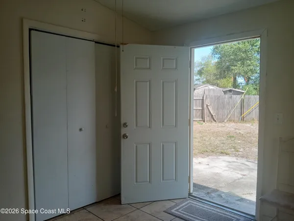 a view of a glass door and the window