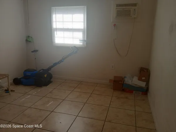 a room with a wooden floor and a carpet