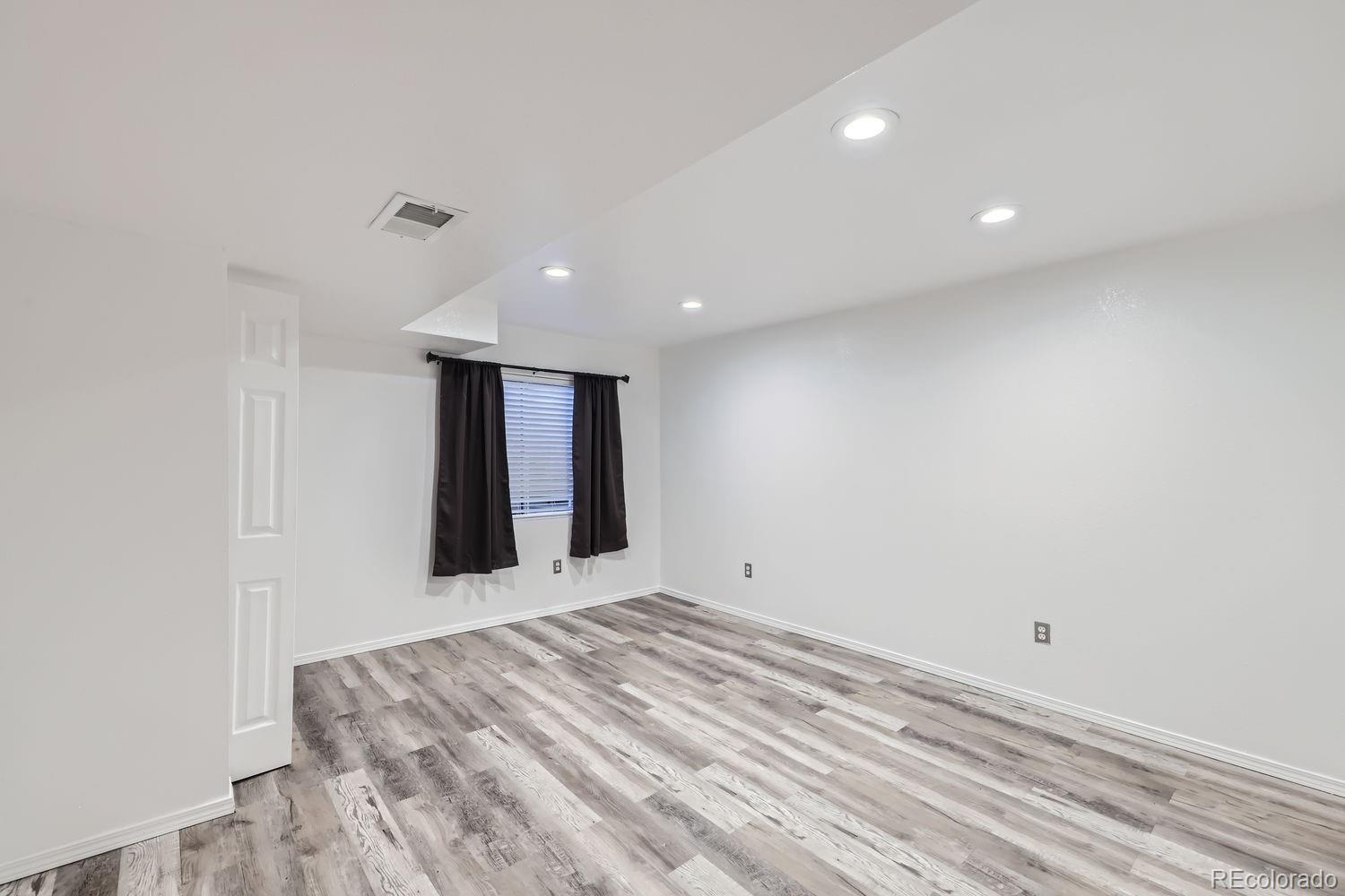 4512 Cornish Way Denver, CO 80239 - Photo 24 of 35 a view of an empty room with closet and a window