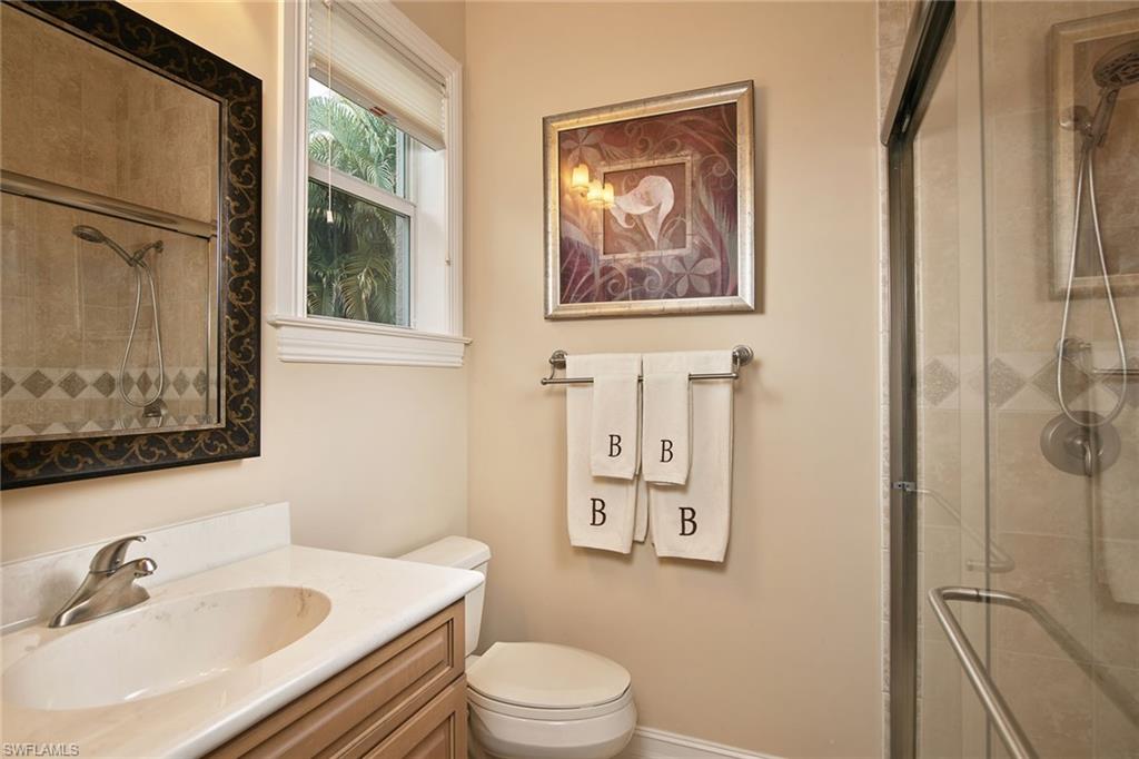 419 Saddlebrook Lane Naples, FL 34110 - Photo 17 of 24 a bathroom with a sink toilet and shower