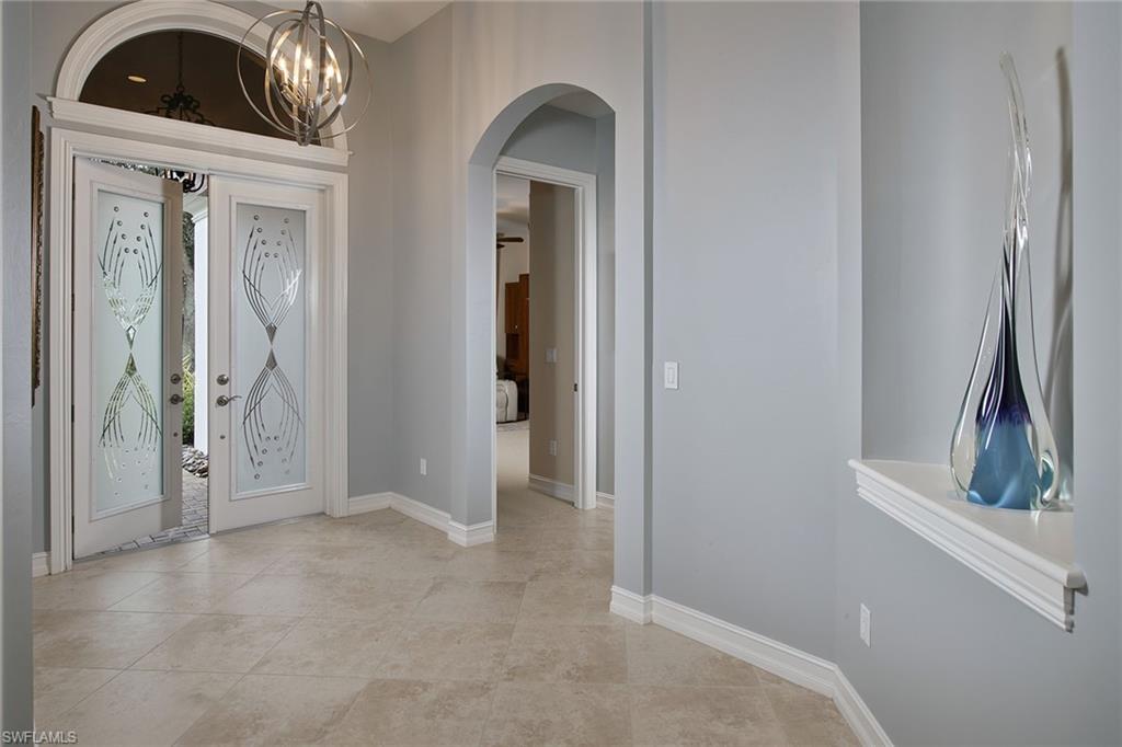 419 Saddlebrook Lane Naples, FL 34110 - Photo 2 of 24 a view of a hallway to closet area