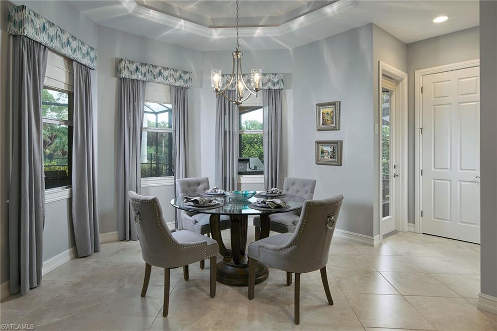 419 Saddlebrook Lane Naples, FL 34110 - Photo 8 of 24 a view of a dining room with furniture window and outside view
