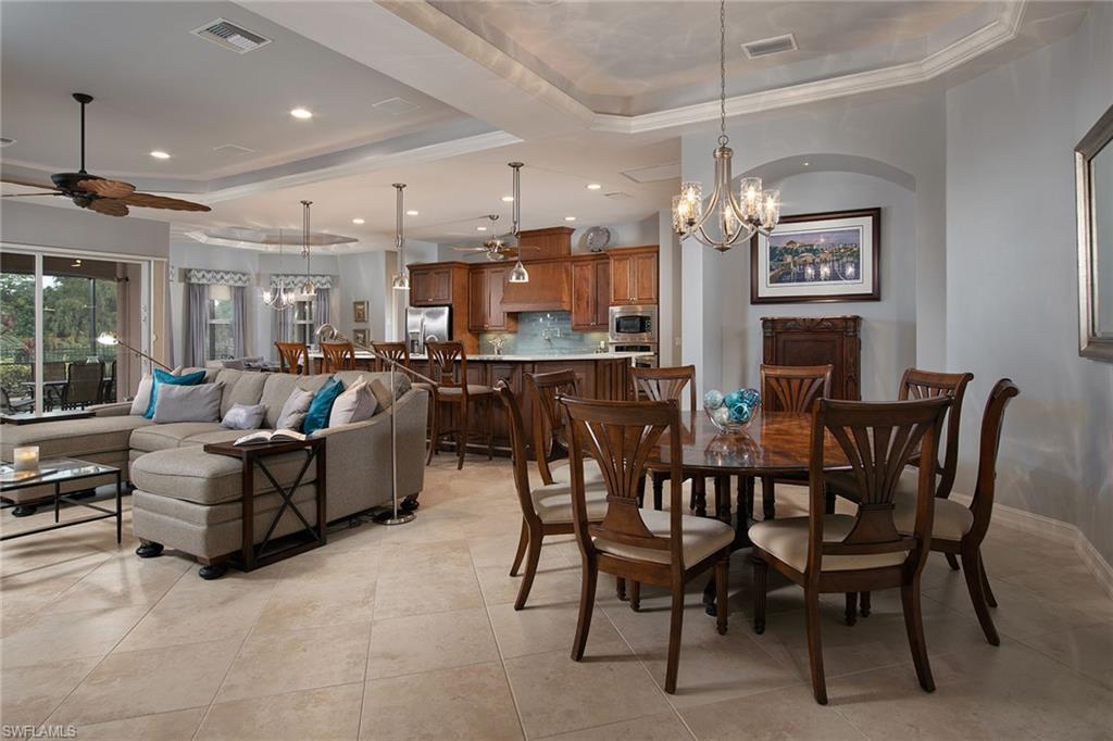 419 Saddlebrook Lane Naples, FL 34110 - Photo 9 of 24 a view of a dining area with furniture
