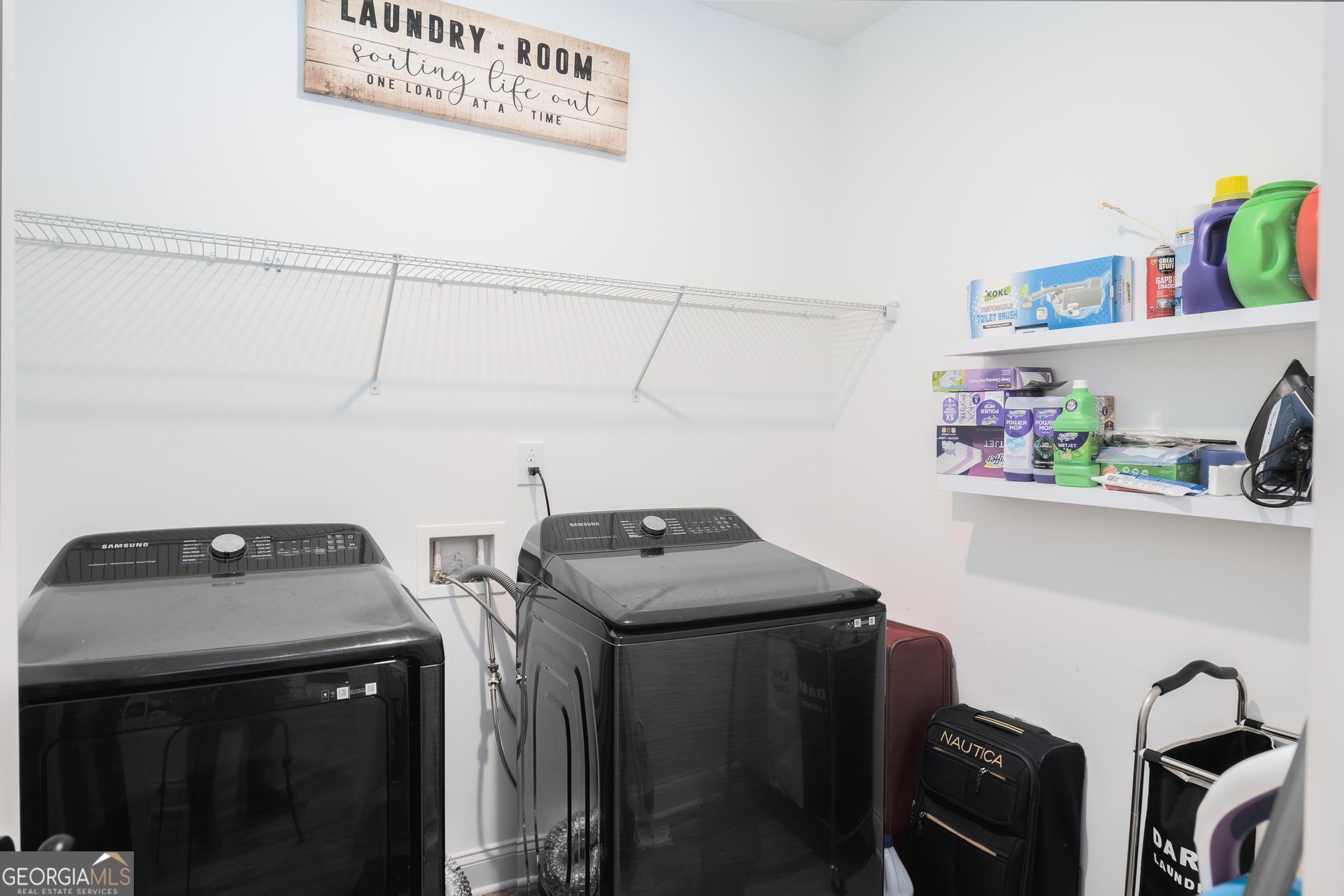 1016 Farmington Road Griffin, GA 30224 - Photo 12 of 31 a utility room with dryer washer and other items