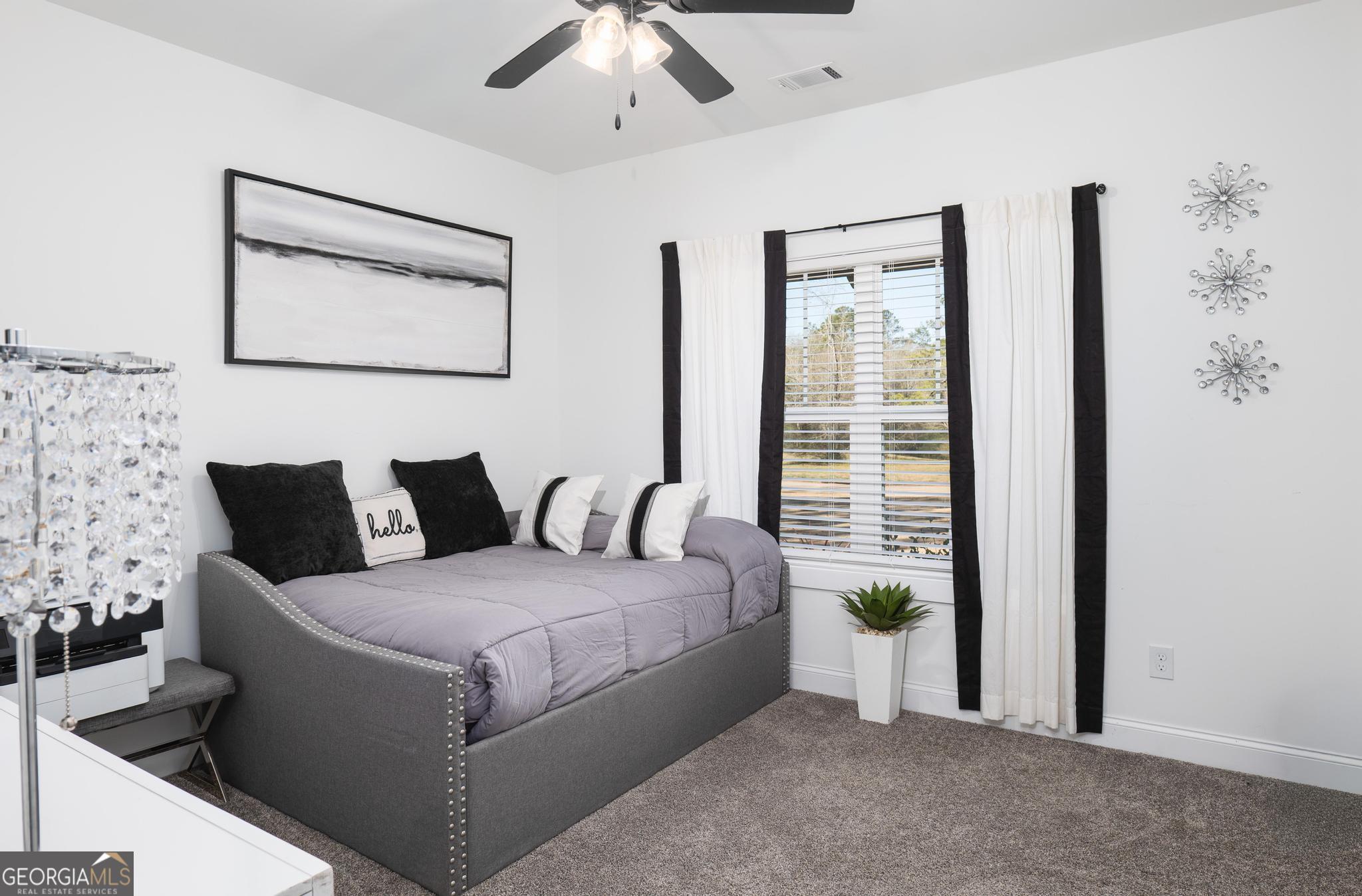 1016 Farmington Road Griffin, GA 30224 - Photo 14 of 31 a living room with furniture and large window