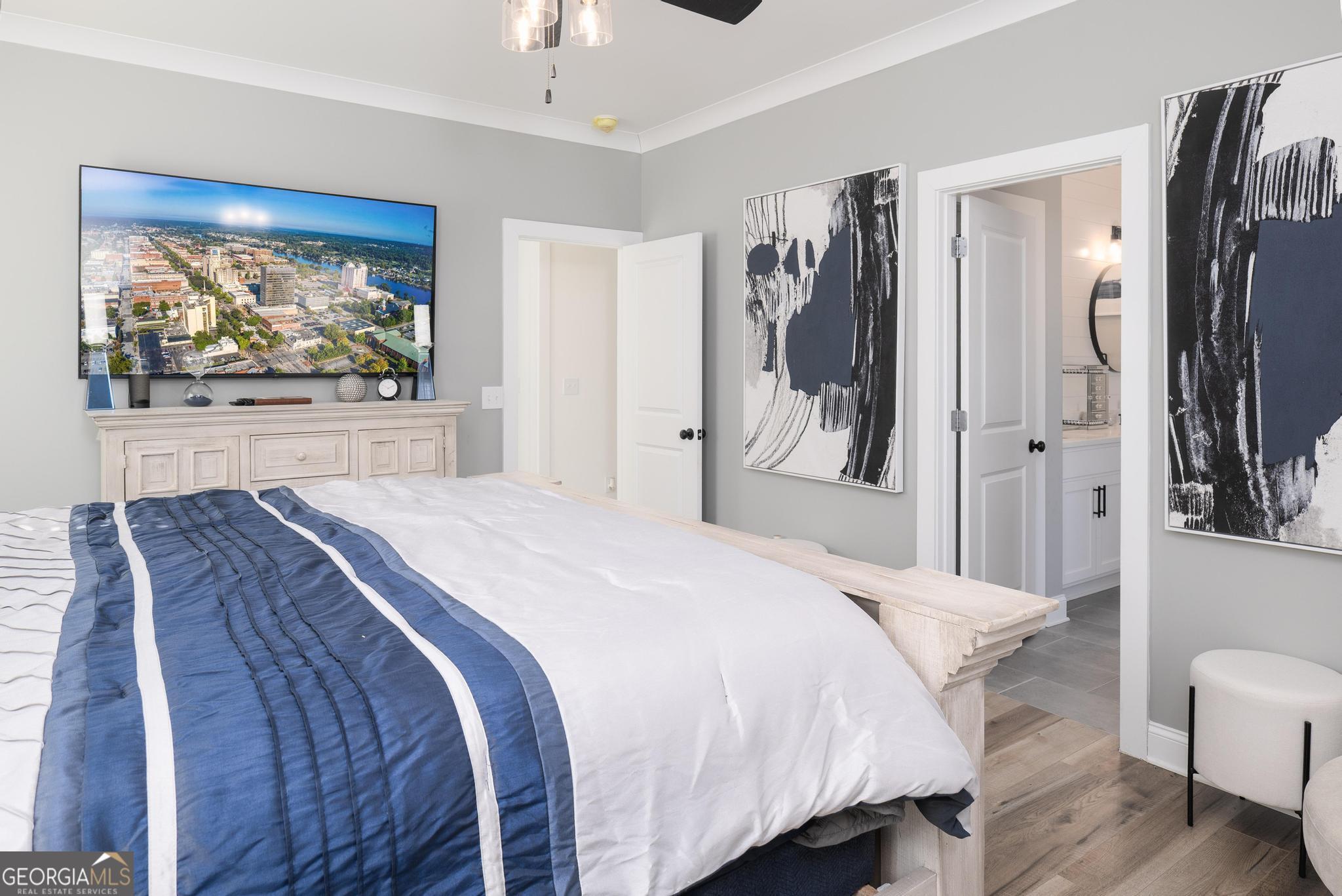 1016 Farmington Road Griffin, GA 30224 - Photo 17 of 31 a bedroom with a bed and a painting on the wall