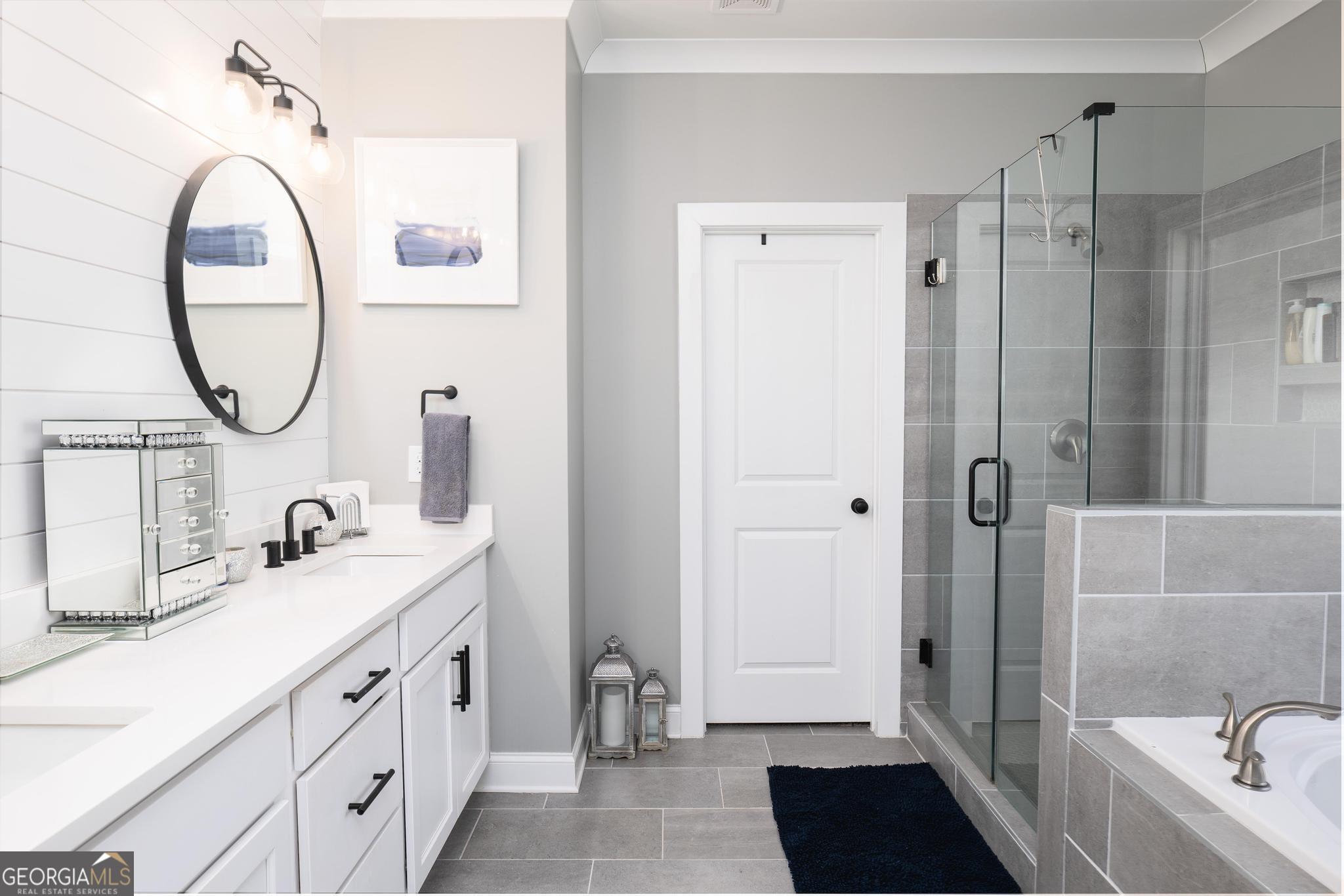 1016 Farmington Road Griffin, GA 30224 - Photo 18 of 31 a bathroom with a sink a toilet and a mirror