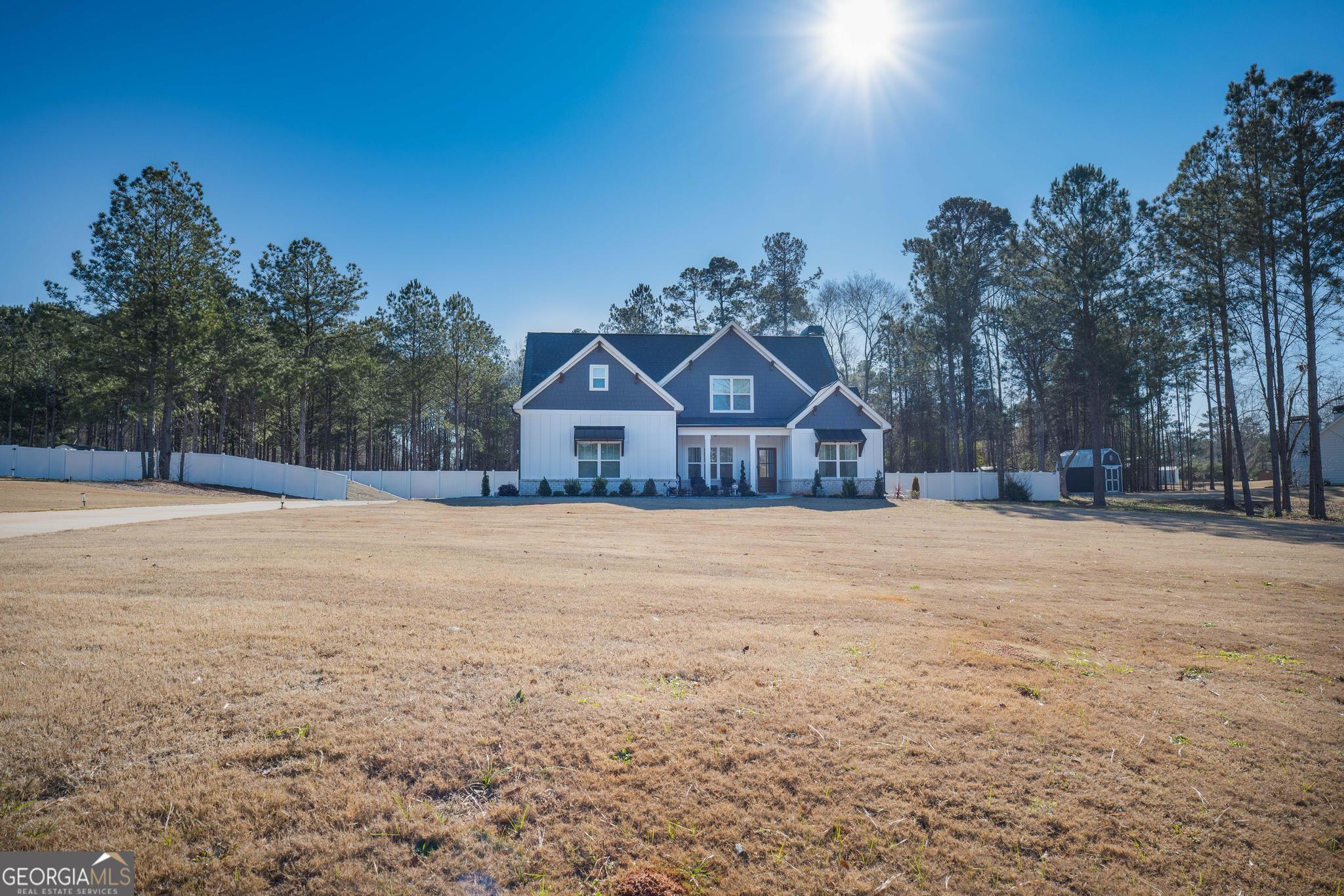 1016 Farmington Road Griffin, GA 30224 - Photo 2 of 31 a house with trees in the background