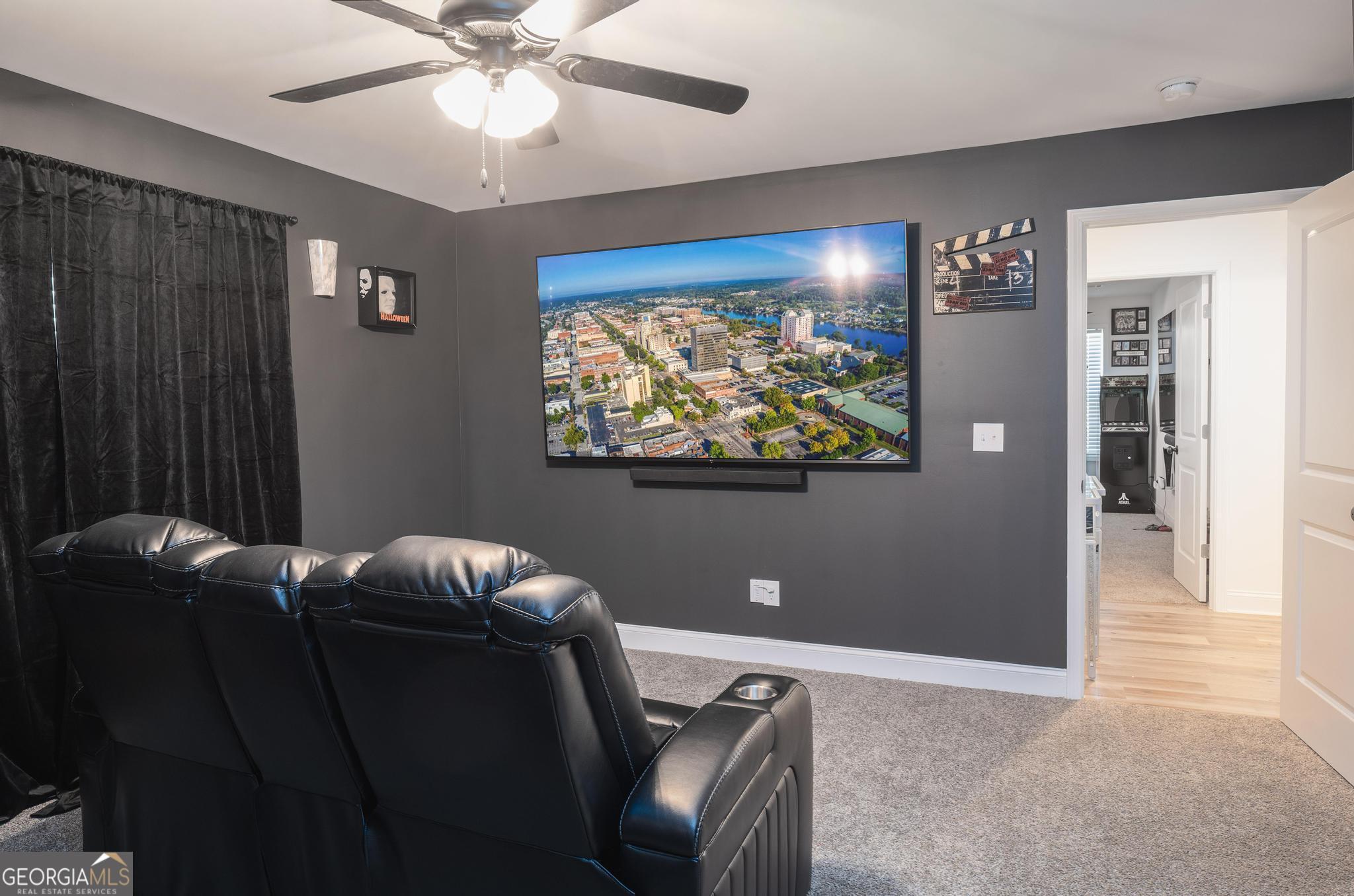 1016 Farmington Road Griffin, GA 30224 - Photo 23 of 31 a living room with furniture and a flat screen tv