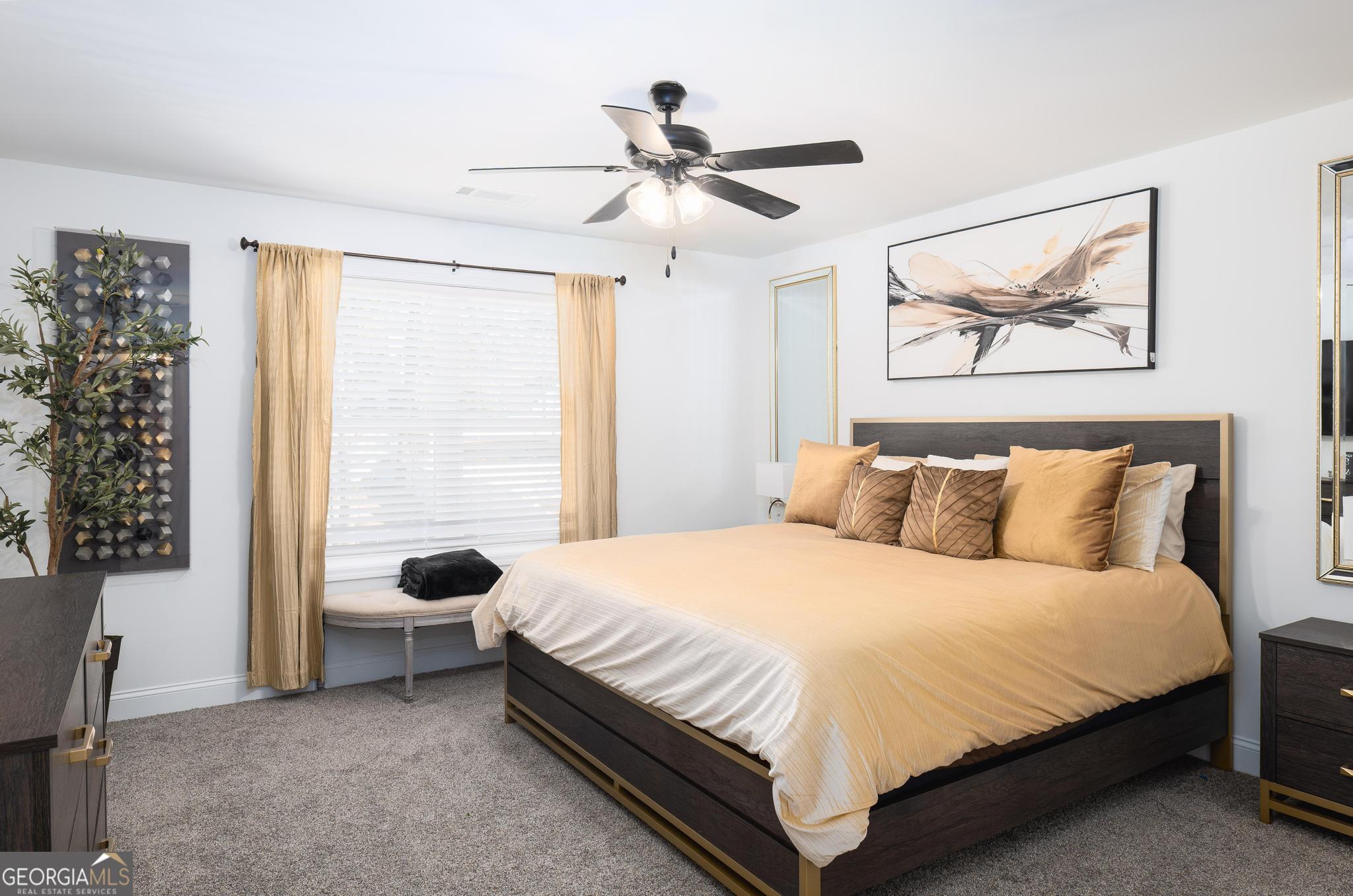 1016 Farmington Road Griffin, GA 30224 - Photo 24 of 31 a bedroom with a bed and a window