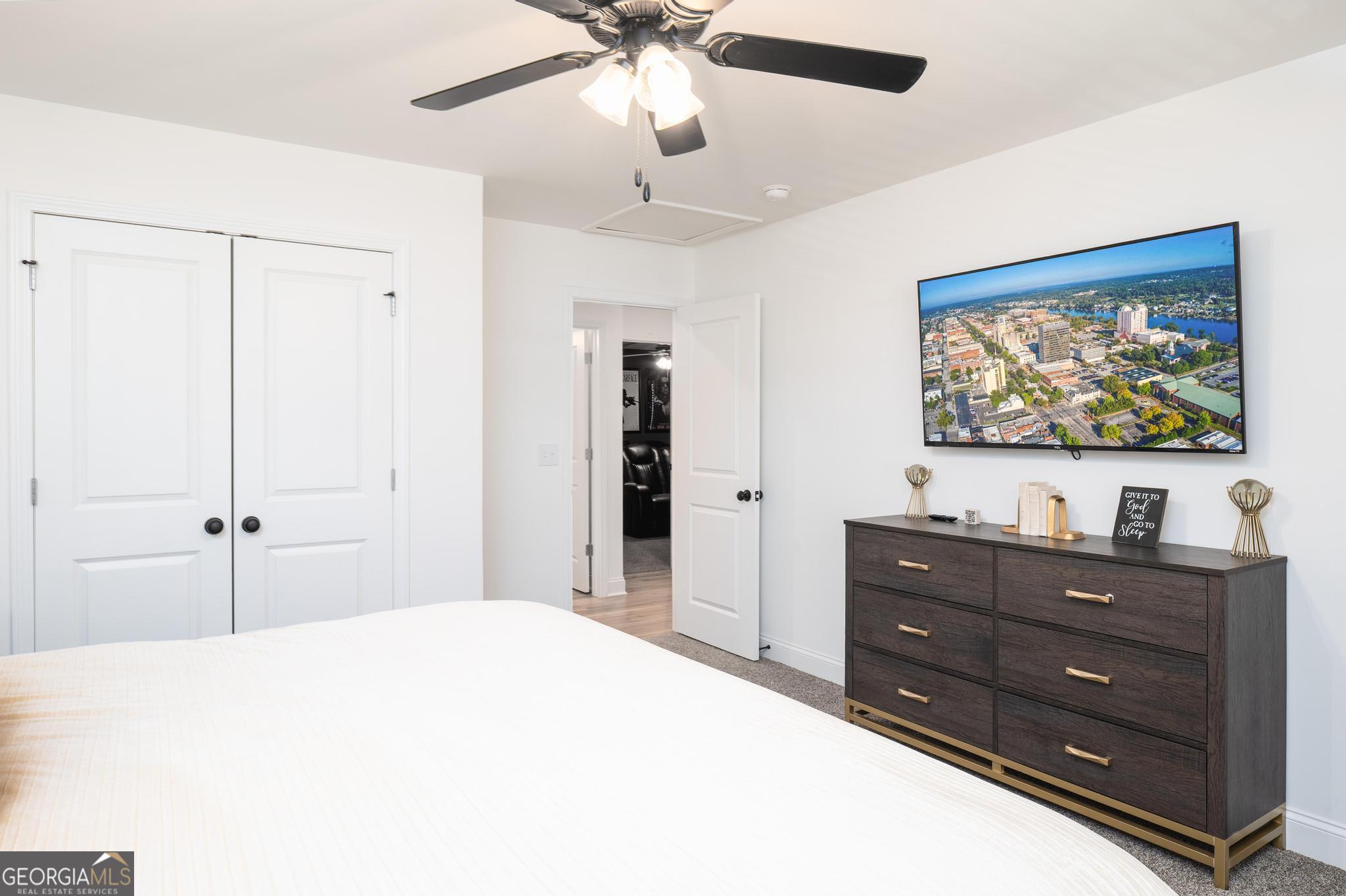 1016 Farmington Road Griffin, GA 30224 - Photo 25 of 31 a bedroom with a bed and a dresser