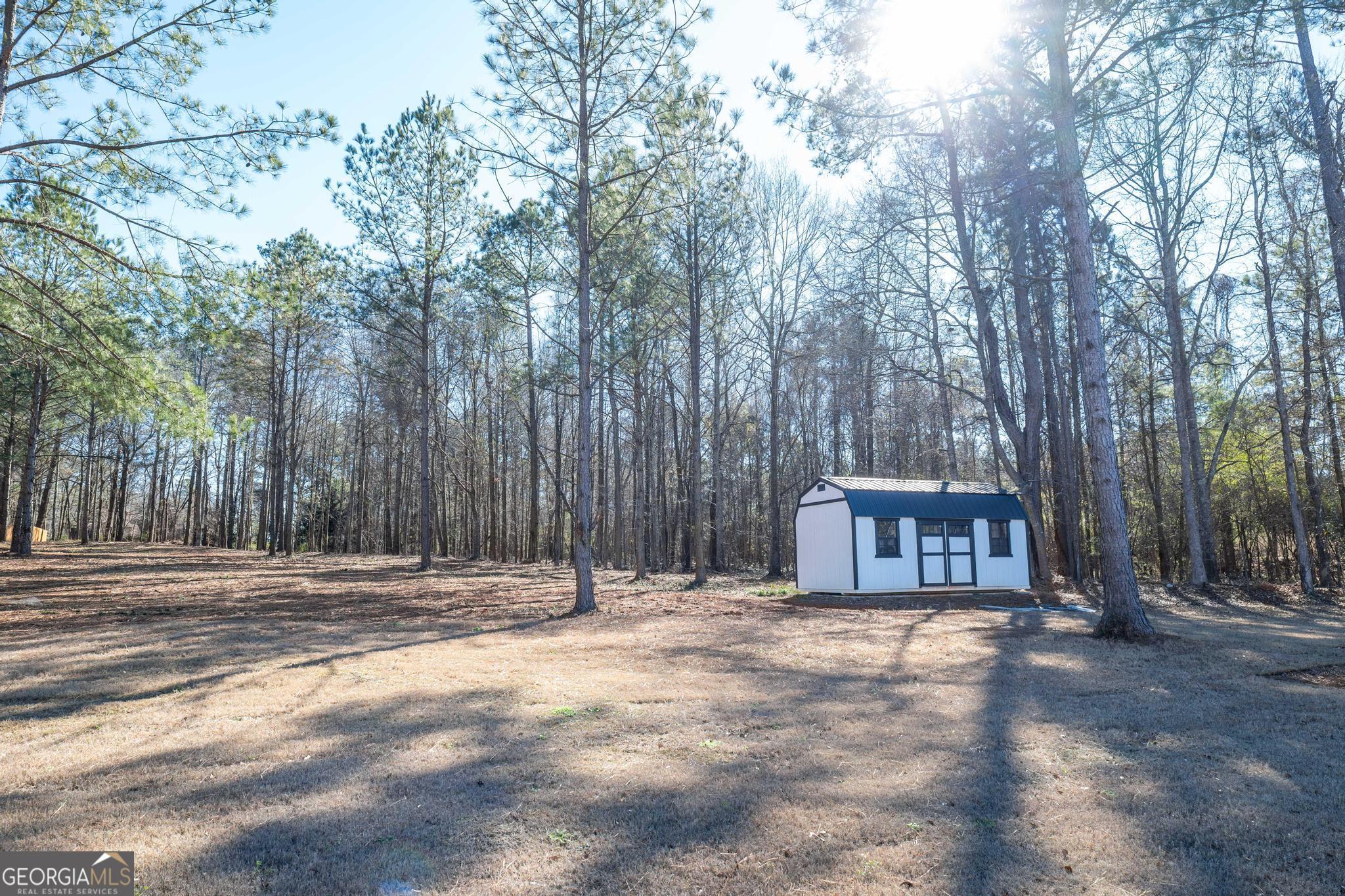 1016 Farmington Road Griffin, GA 30224 - Photo 29 of 31 a house view with a backyard space
