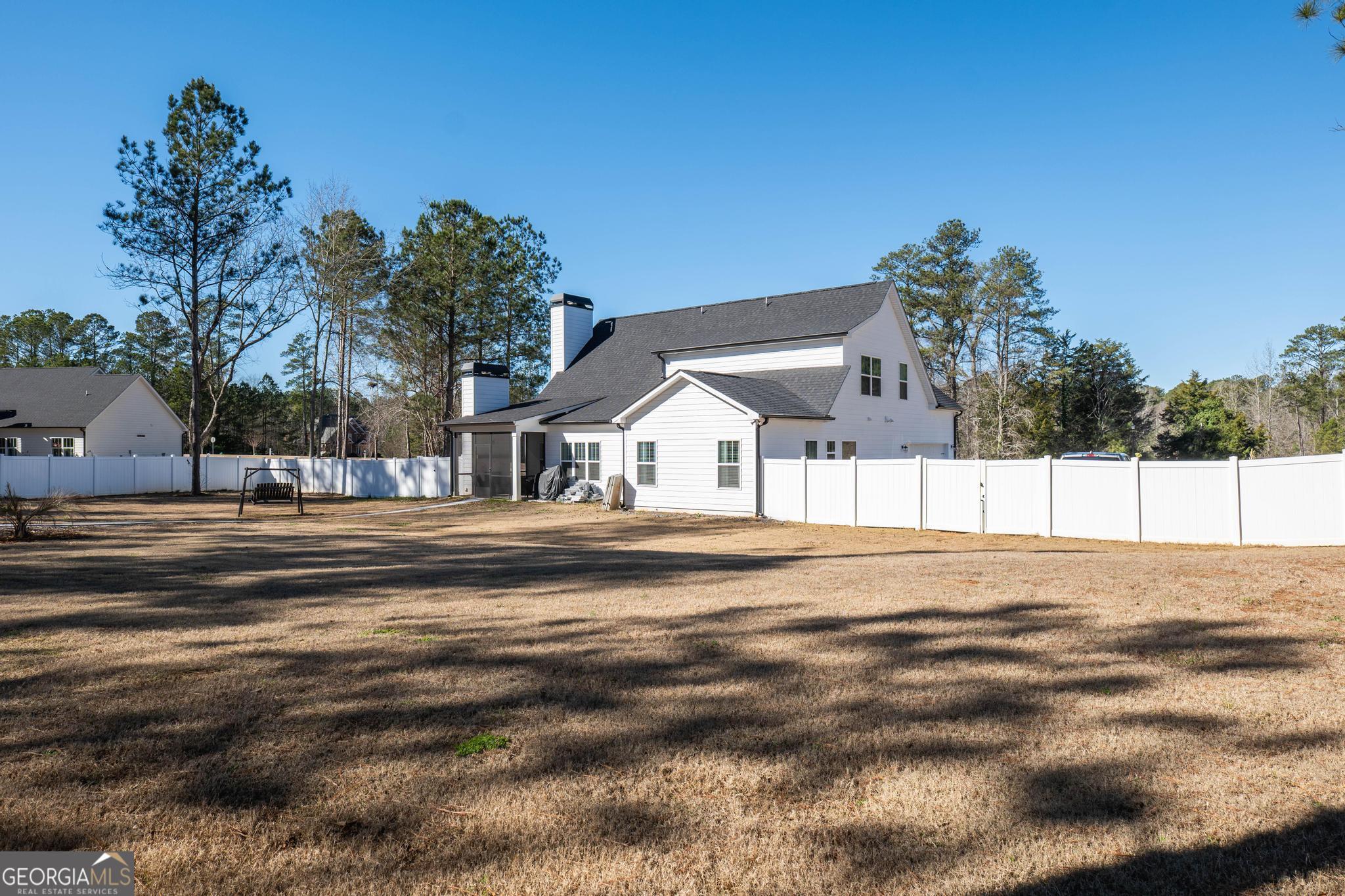 1016 Farmington Road Griffin, GA 30224 - Photo 31 of 31 a view of white house with a yard