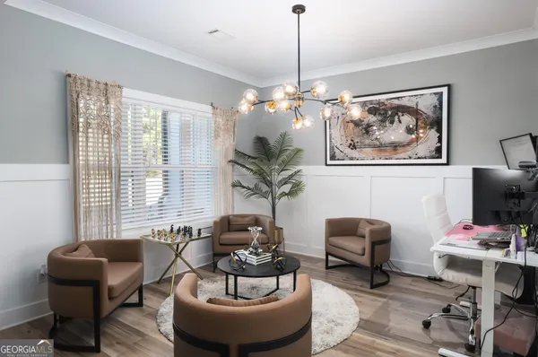 a living room with furniture a piano and a window