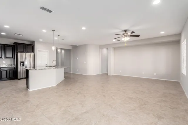 a view of a kitchen with a sink and cabinet