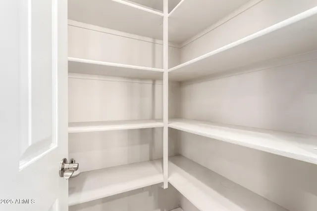a kitchen with granite countertop stainless steel appliances and wooden cabinets