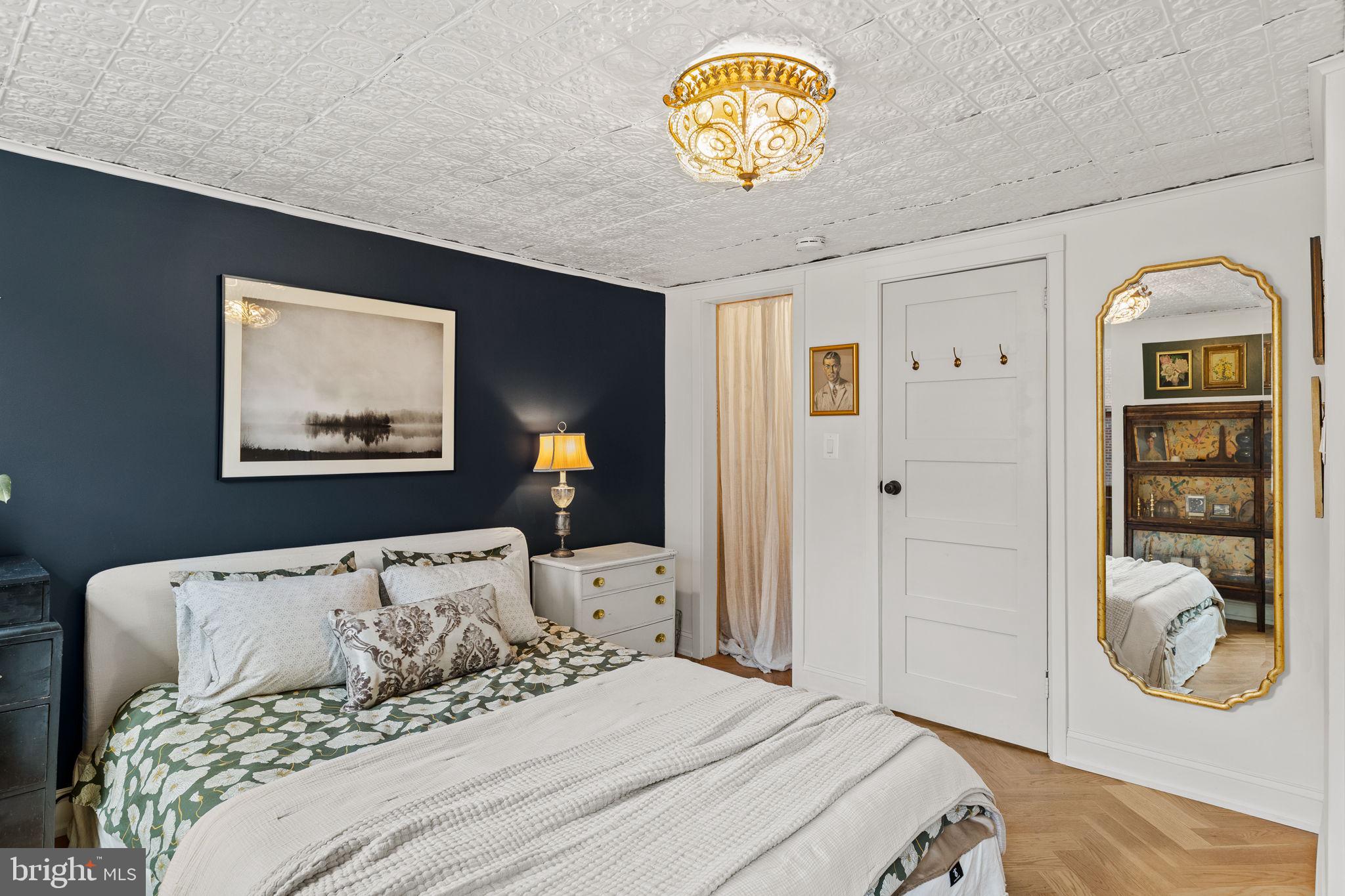 630 Fitzwater Street Philadelphia, PA 19147 - Photo 14 of 25 a bedroom with a bed and painting on the wall