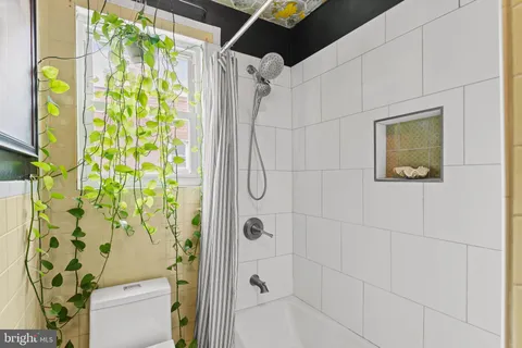 a bed room with a bed and a chair