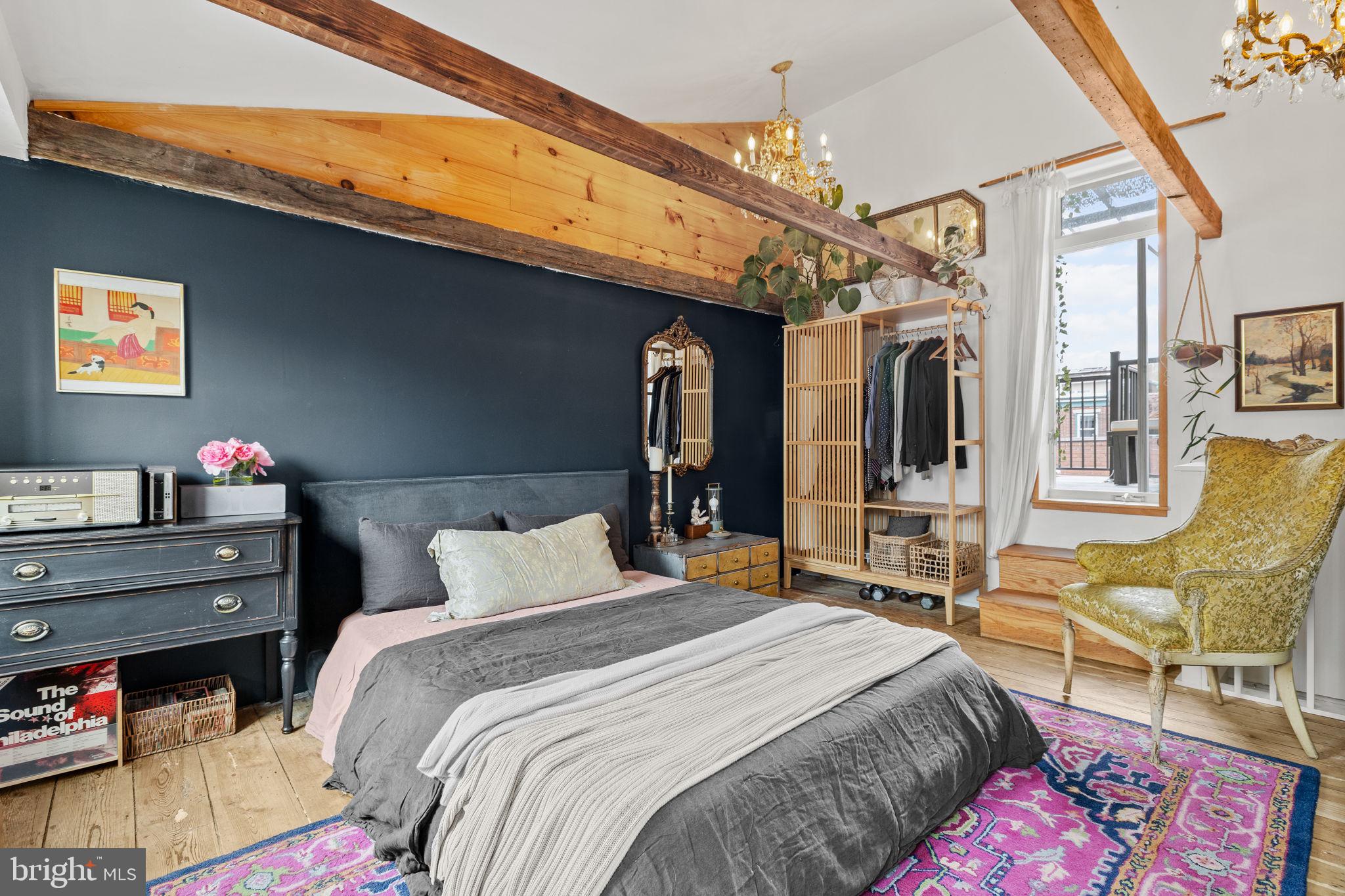 630 Fitzwater Street Philadelphia, PA 19147 - Photo 20 of 25 a bedroom with a bed a chair and glass walk in closet