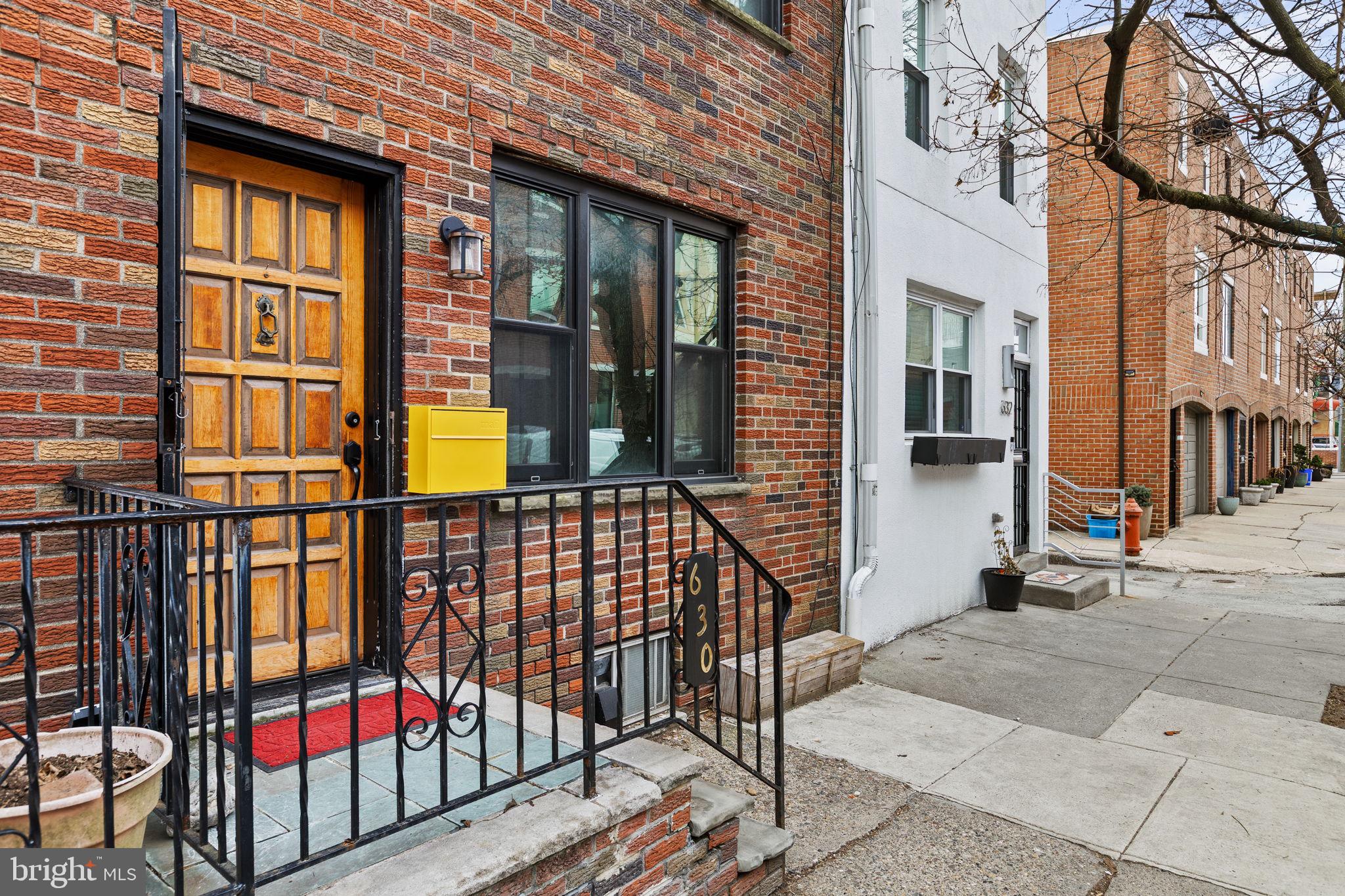 630 Fitzwater Street Philadelphia, PA 19147 - Photo 2 of 25 a view of a brick house with glass windows