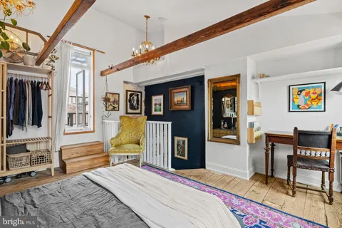 a outdoor living space with furniture and wooden floor