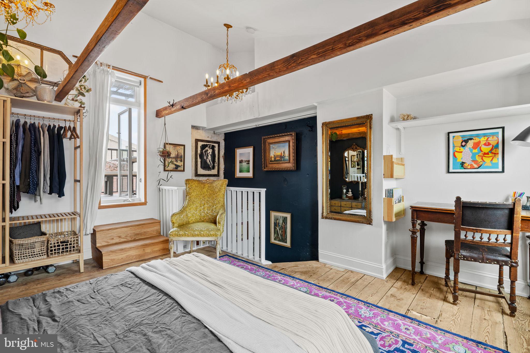 630 Fitzwater Street Philadelphia, PA 19147 - Photo 21 of 25 a bedroom with a bed a dresser and chair