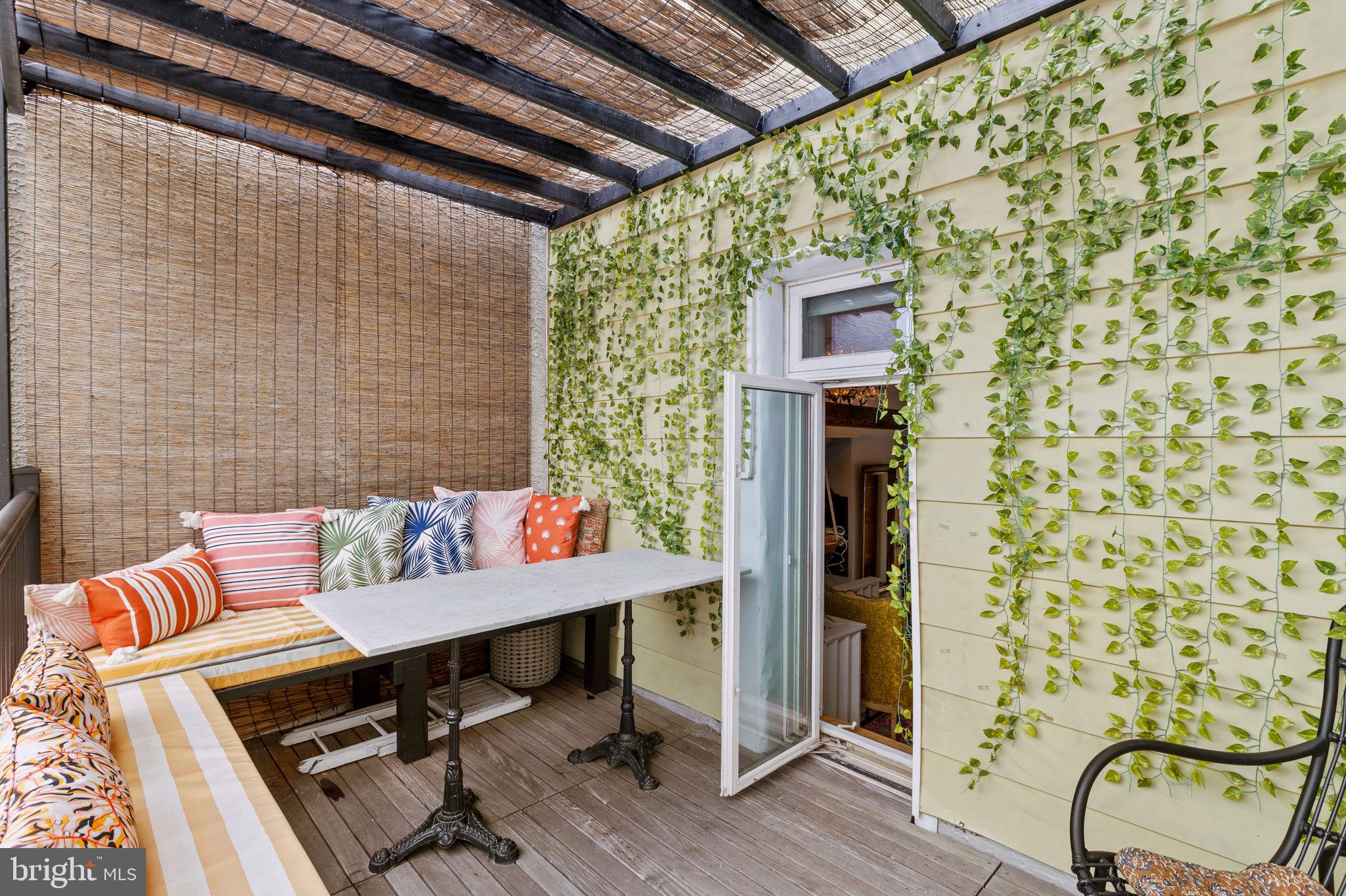 630 Fitzwater Street Philadelphia, PA 19147 - Photo 23 of 25 a outdoor living space with furniture and wooden floor