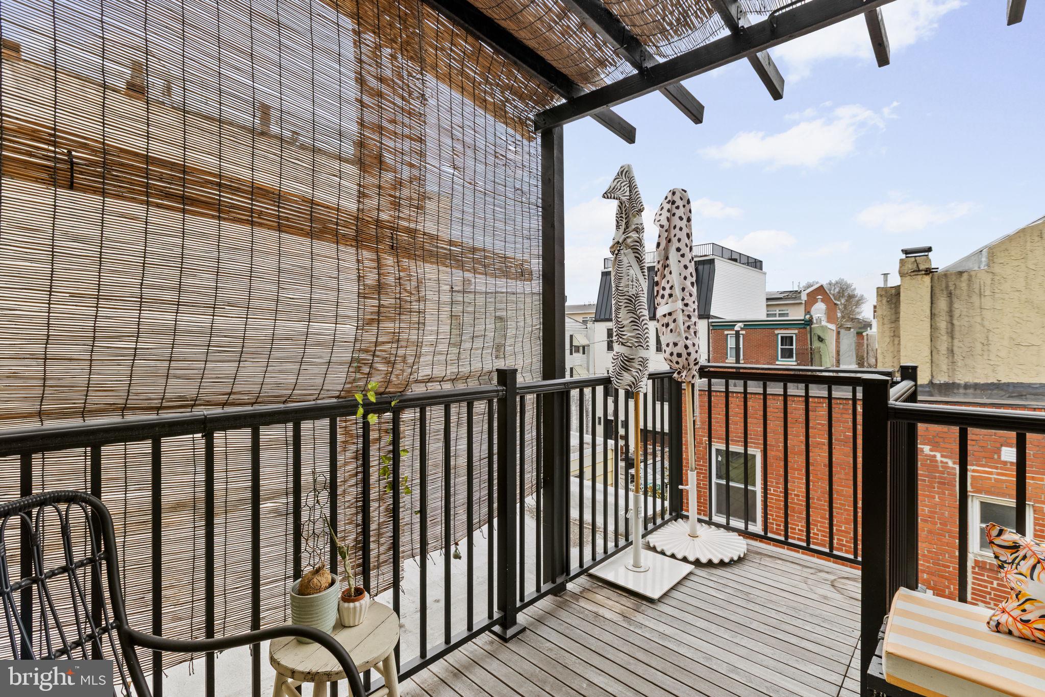 630 Fitzwater Street Philadelphia, PA 19147 - Photo 24 of 25 a view of a balcony with wooden floor and fence