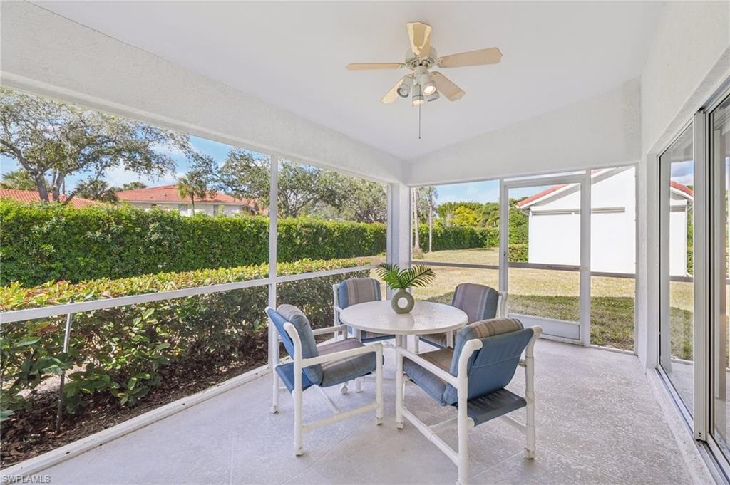 387 Melrose Place Naples, FL 34104 - Photo 19 of 26 a living room with furniture and a large window