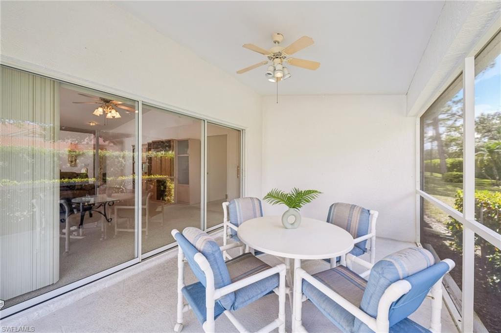 387 Melrose Place Naples, FL 34104 - Photo 20 of 26 a view of a dining room with furniture window and wooden floor
