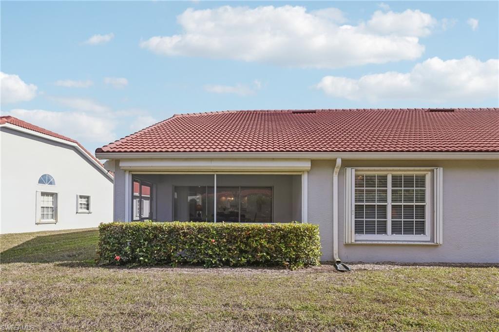 387 Melrose Place Naples, FL 34104 - Photo 21 of 26 a front view of a house