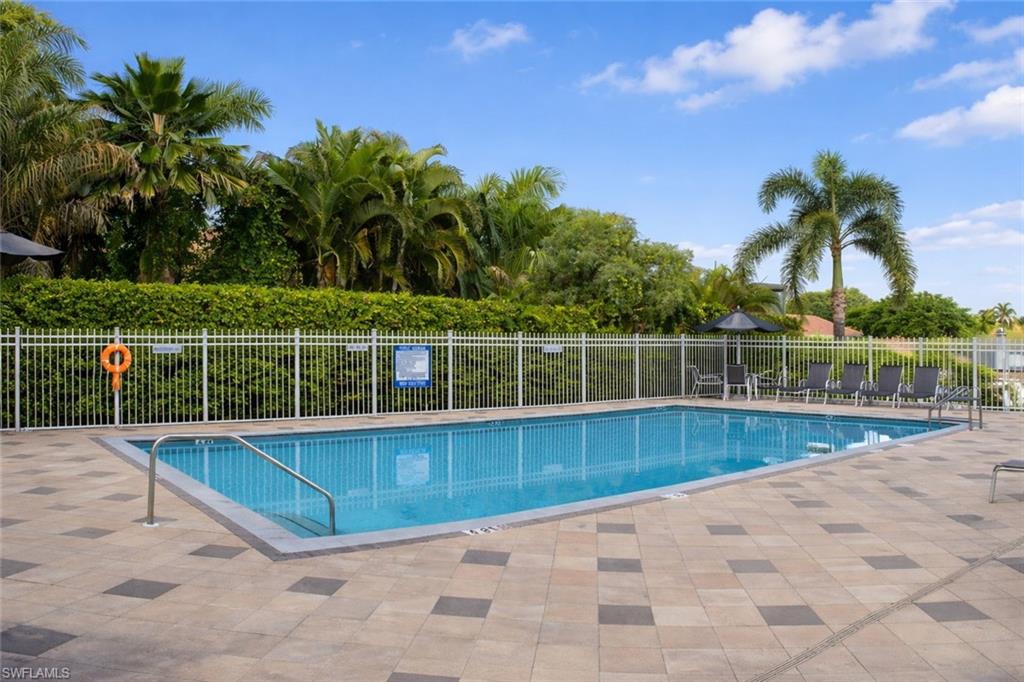387 Melrose Place Naples, FL 34104 - Photo 24 of 26 a view of a backyard with palm trees