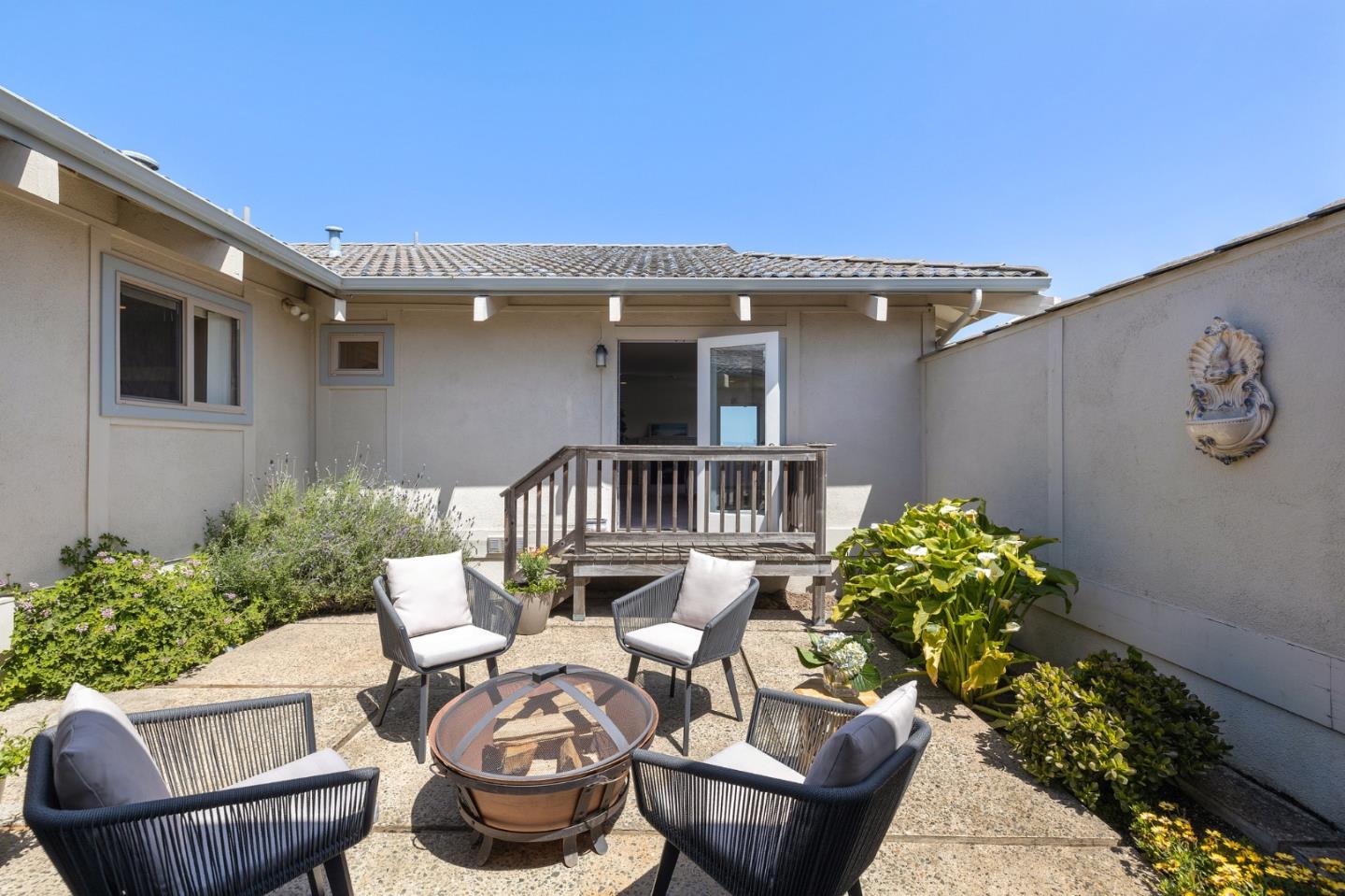 1244 Surf Avenue Pacific Grove, CA 93950 - Photo 20 of 43 a front view of a house with garden
