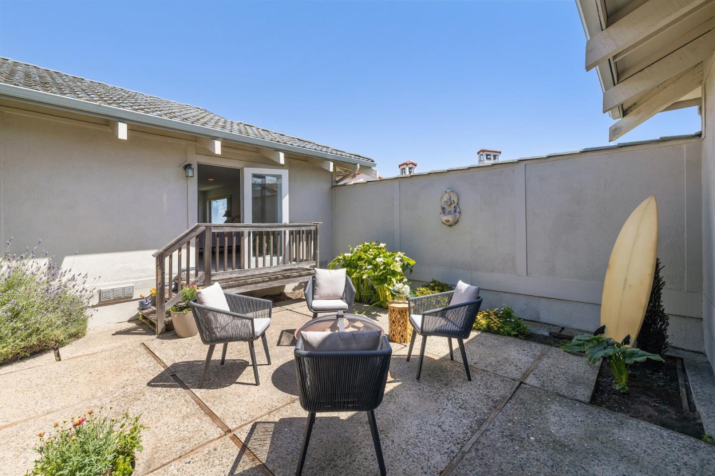 1244 Surf Avenue Pacific Grove, CA 93950 - Photo 21 of 43 a view of a chairs and table in patio