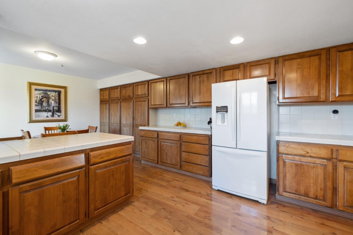 1244 Surf Avenue Pacific Grove, CA 93950 - Photo 24 of 43 a kitchen with a refrigerator sink and cabinets