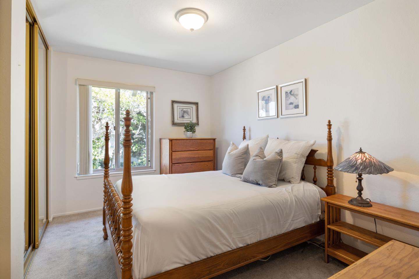 1244 Surf Avenue Pacific Grove, CA 93950 - Photo 28 of 43 a bedroom with bed and window