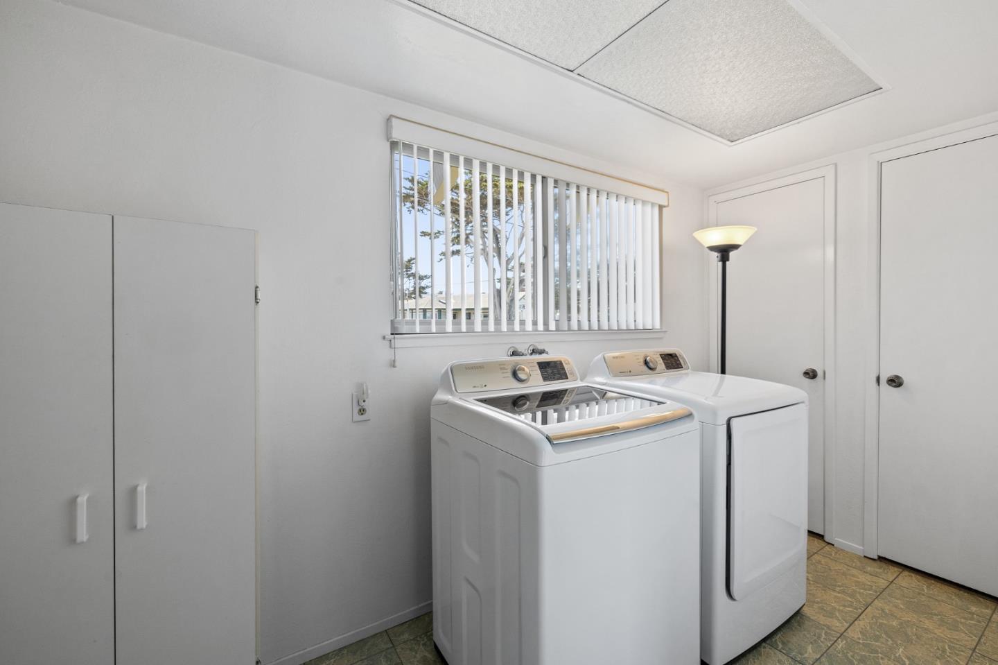 1244 Surf Avenue Pacific Grove, CA 93950 - Photo 29 of 43 a utility room with dryer and washer