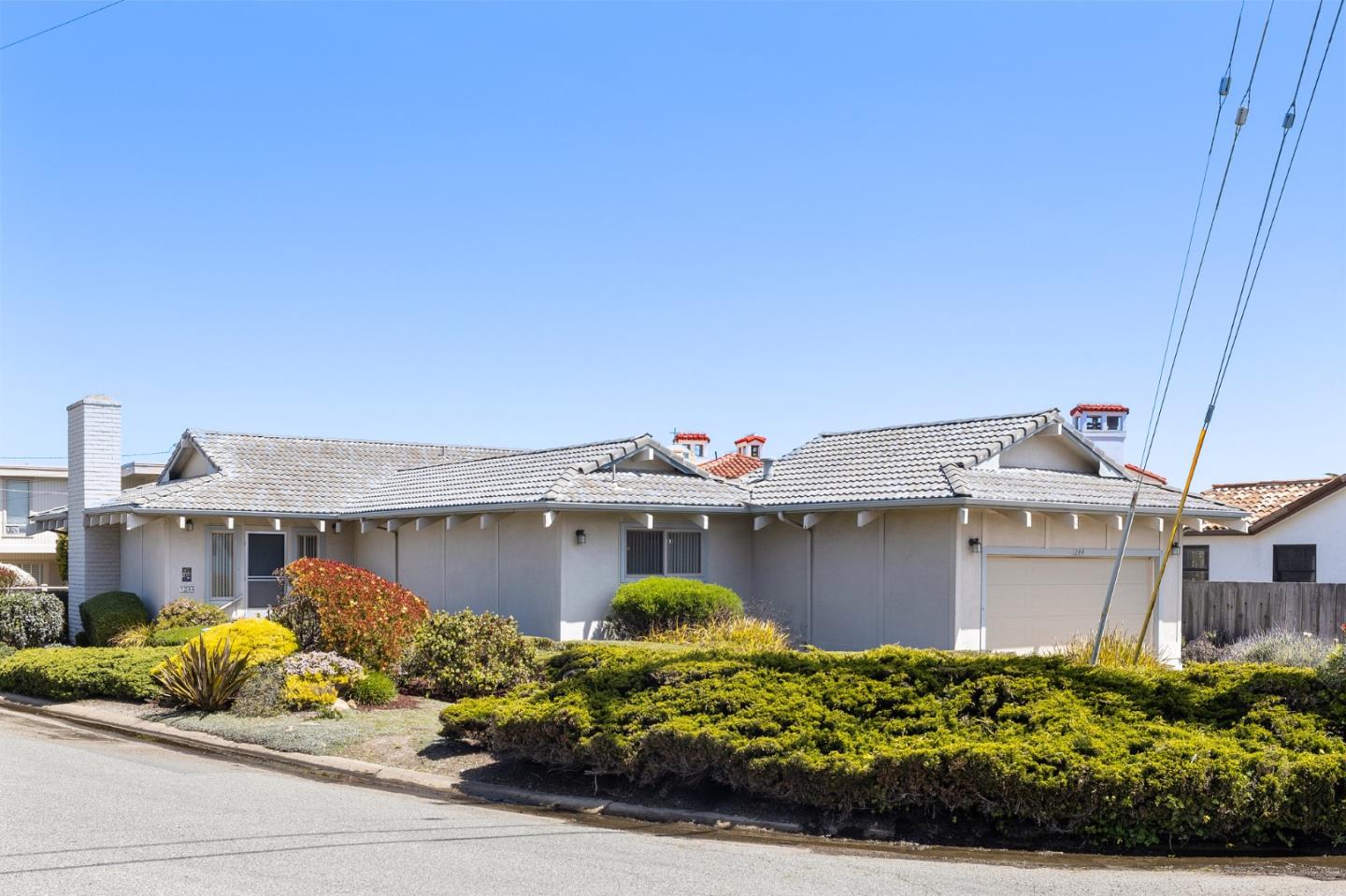 1244 Surf Avenue Pacific Grove, CA 93950 - Photo 33 of 43 front view of a house with a small yard