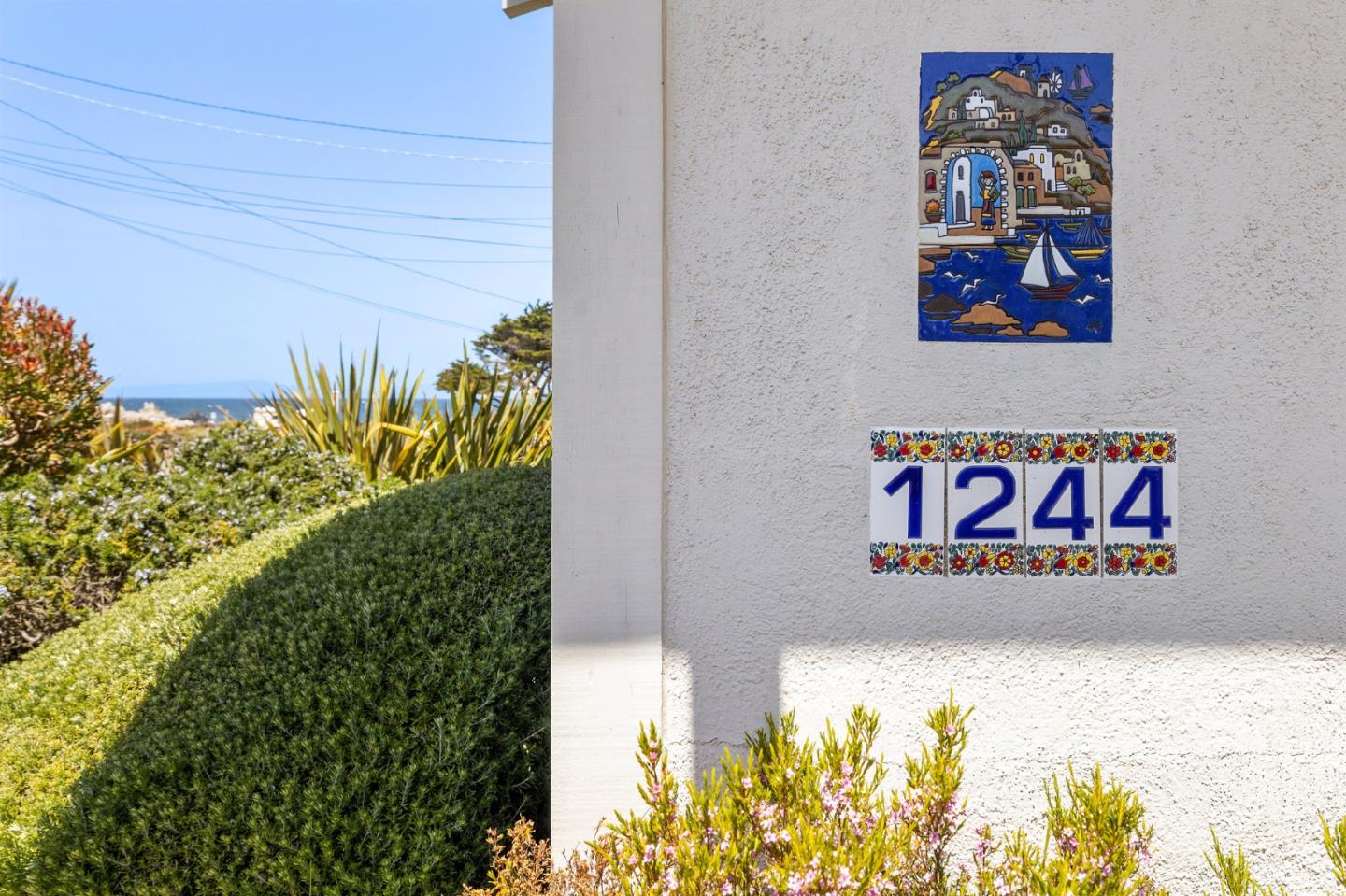 1244 Surf Avenue Pacific Grove, CA 93950 - Photo 5 of 43 a sign that is sitting on a wooden floor